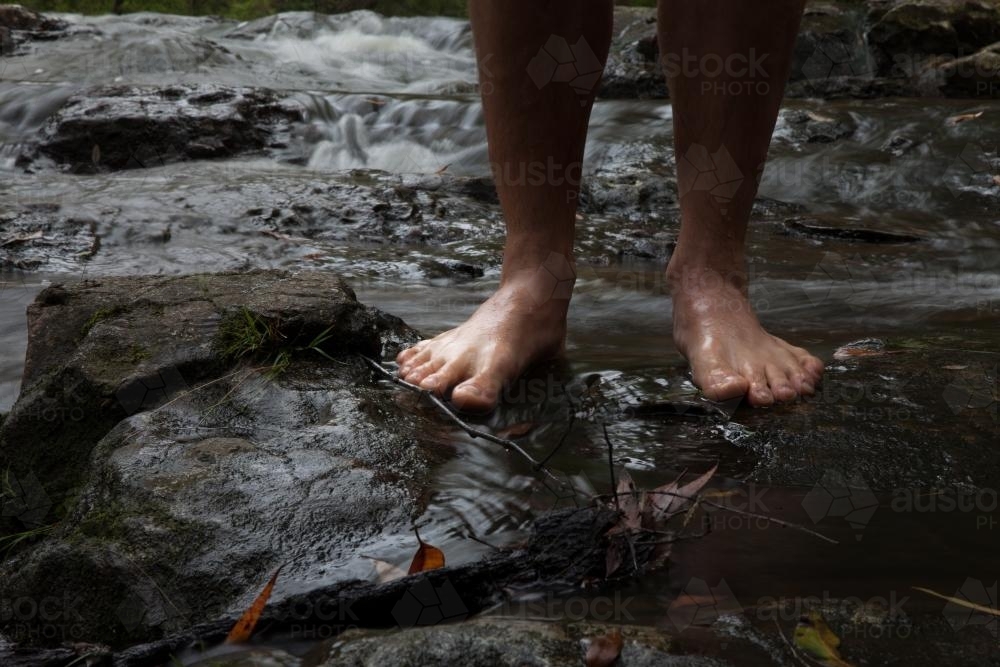 Feet in rock pool at Minyon Falls - Australian Stock Image