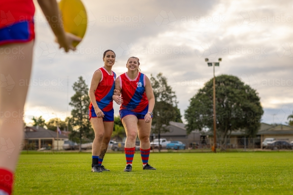 female aussie rules football players practising drills at training - Australian Stock Image
