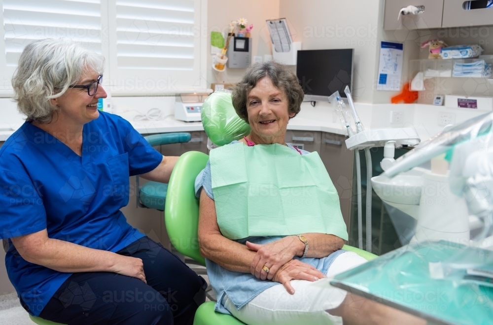 Female dentist with elderly female patient - Australian Stock Image