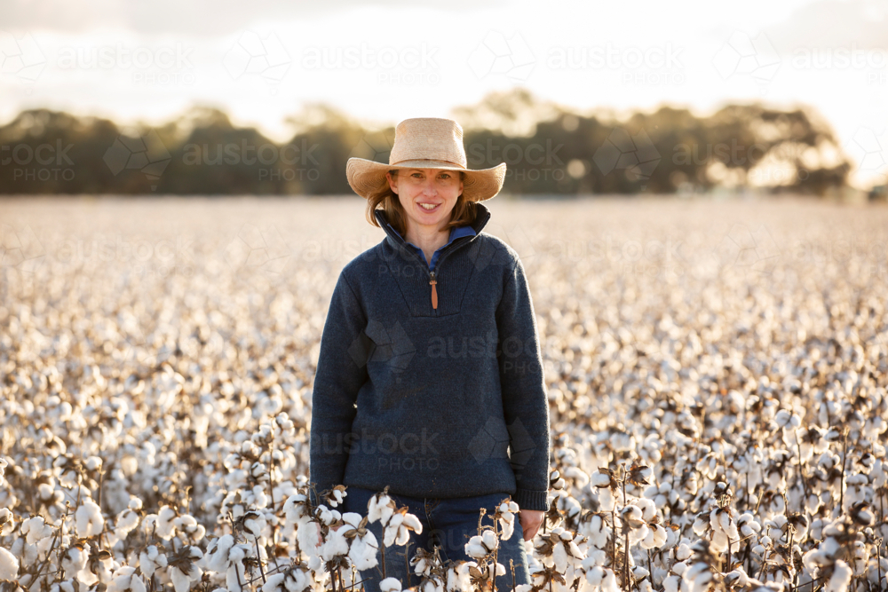 Female farmer standing in cotton crop - Australian Stock Image