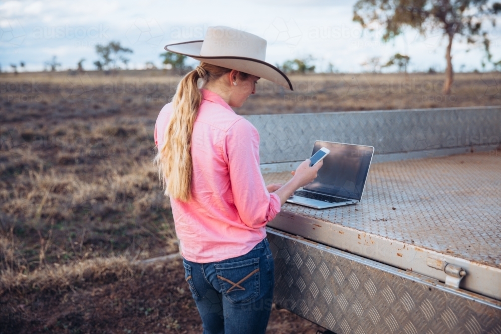 Female farmer using technology - Australian Stock Image