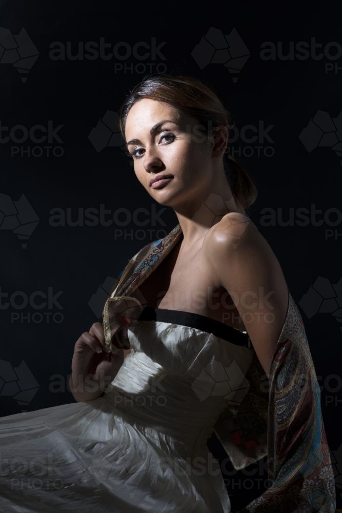 Female fashion model in low key lighting - Australian Stock Image