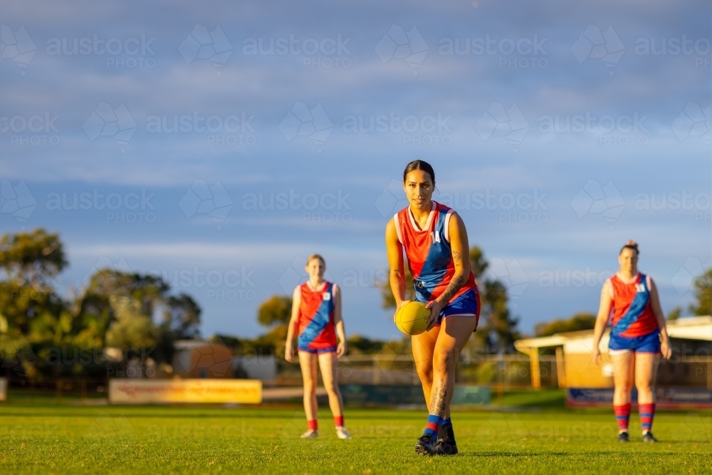 female football players in red and blue uniforms at training - Australian Stock Image