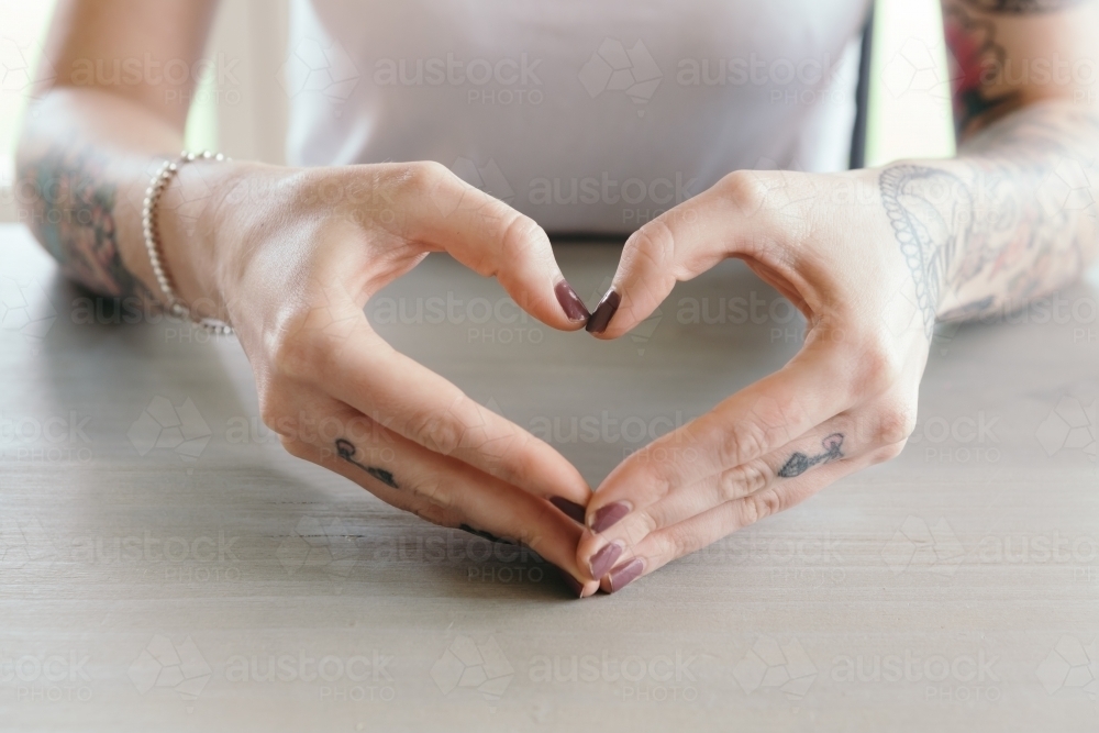 Female hands making a heart shape - Australian Stock Image