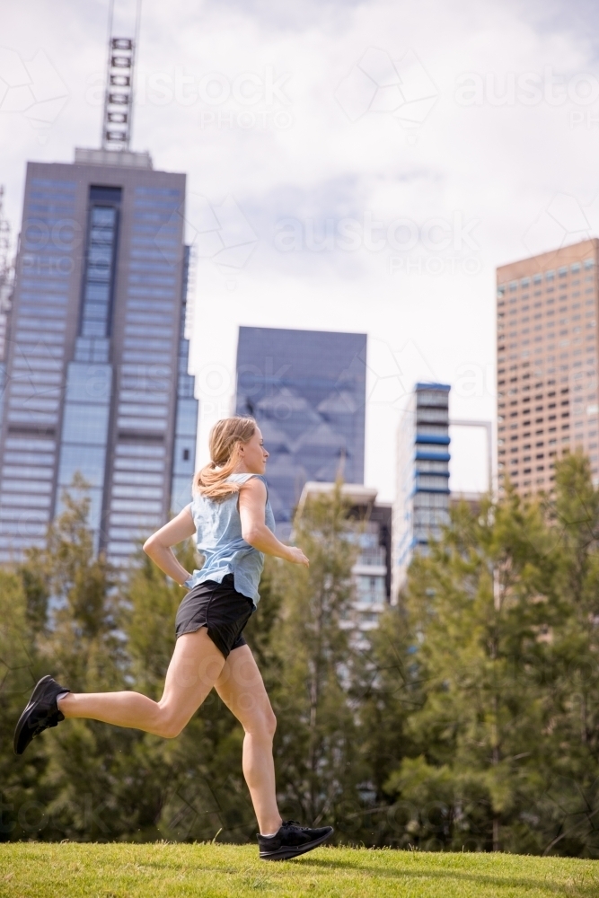 Female Jogger Working Out in the City - Australian Stock Image