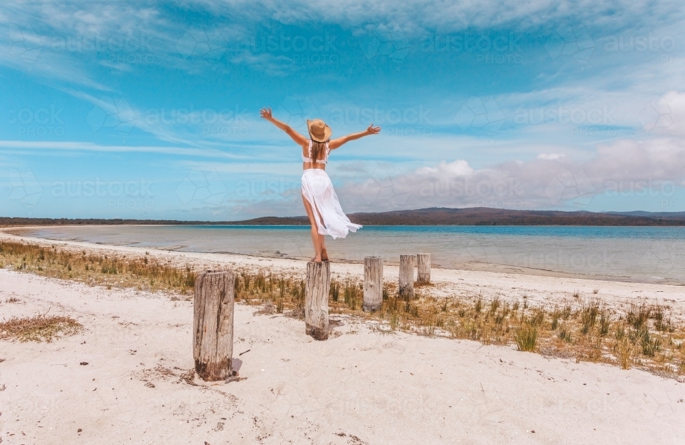 Female joy freedom live life to the full travel beach concept - Australian Stock Image