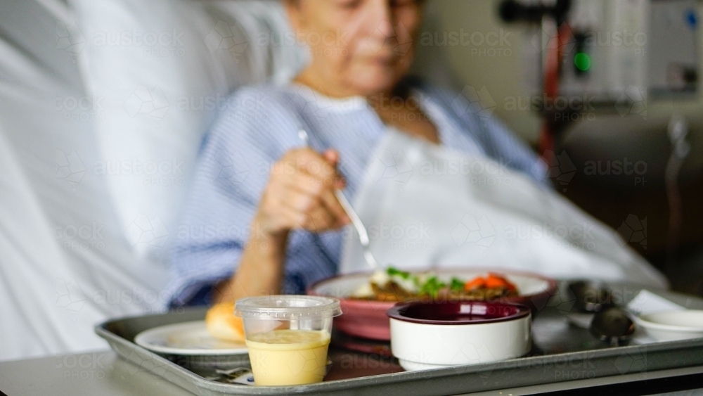 Female patient dining on hospital food : Austockphoto Female patient dining on hospital food - Australian Stock Image