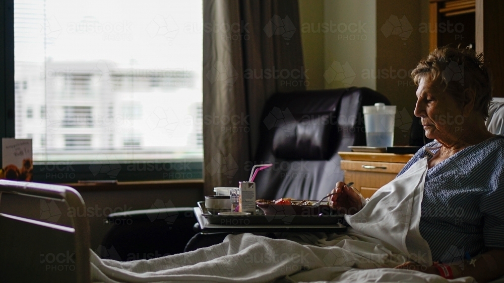 Female patient is hospital bed - Australian Stock Image