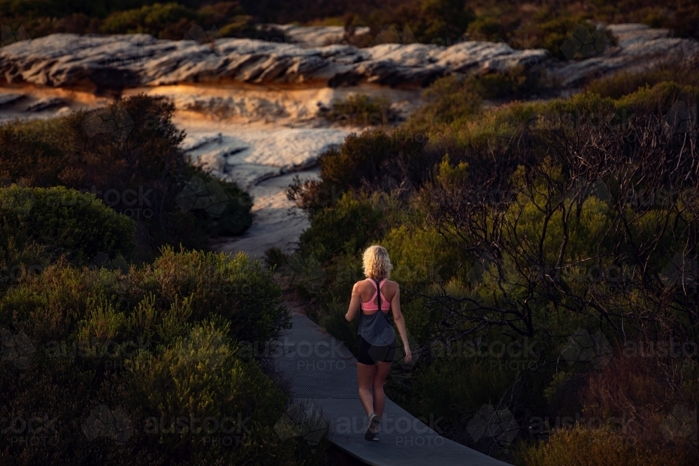 Female runner Morning Cliffside - Australian Stock Image