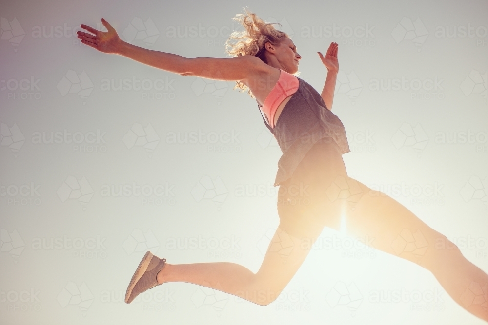 Female runner Morning Cliffside - Australian Stock Image