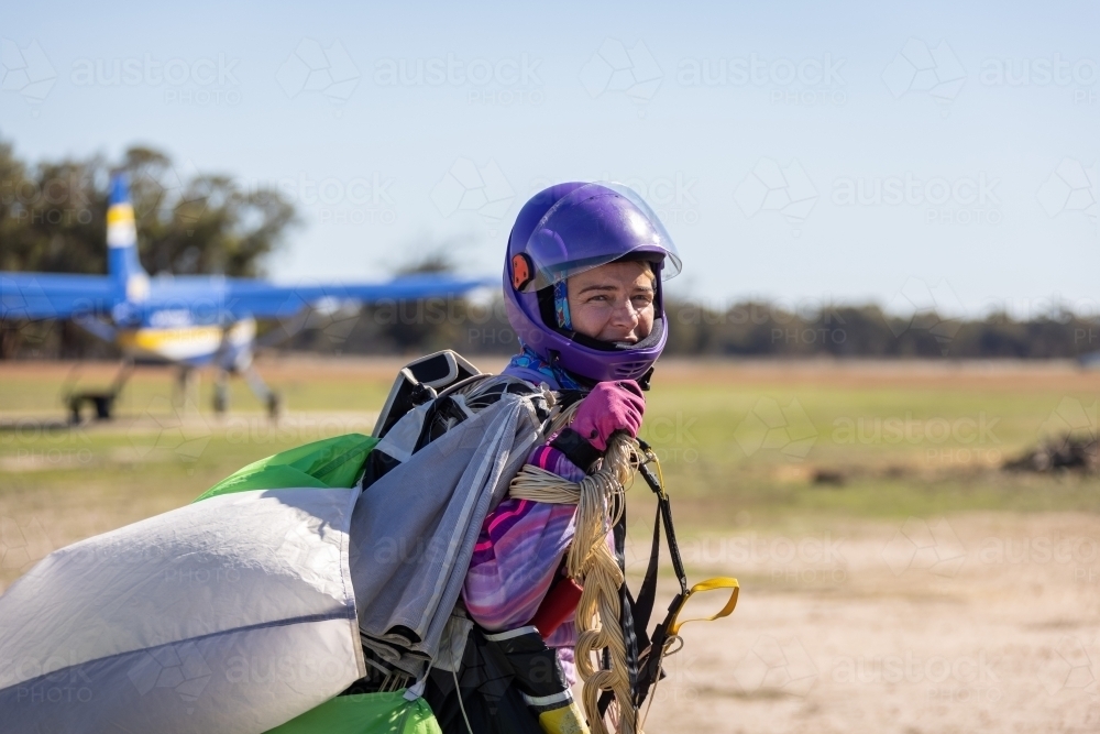 female skydiver returning to base after a successful jump - Australian Stock Image