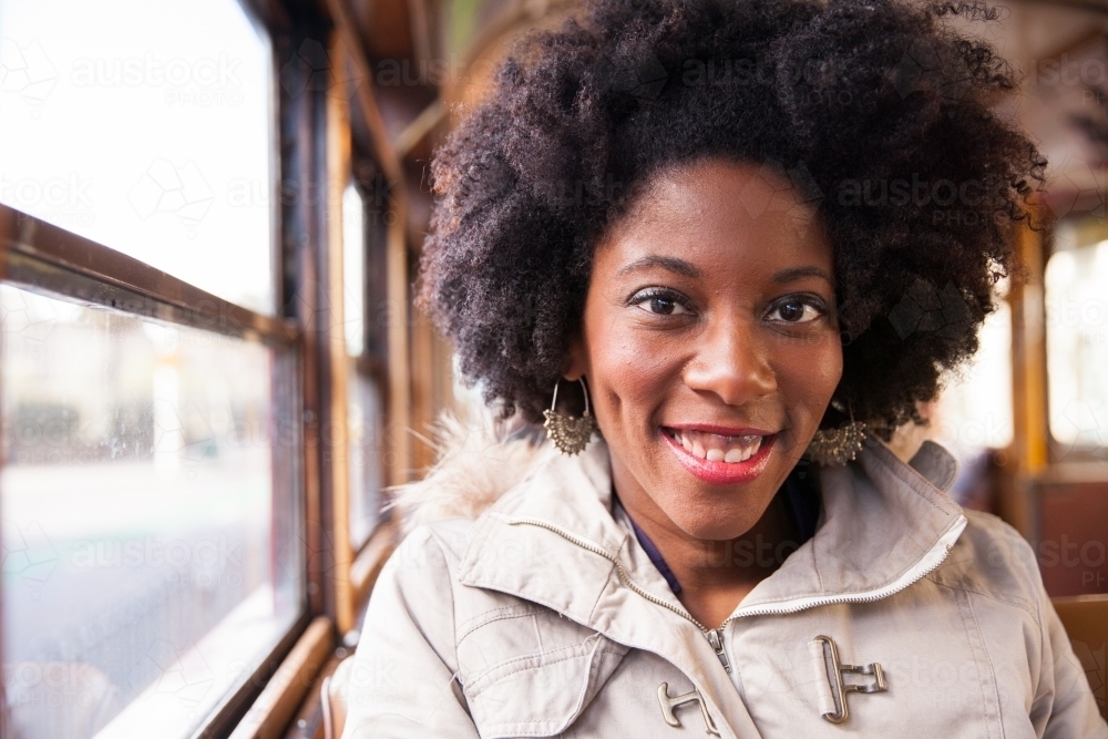 Female Tourist Riding on the City Circle Tram Melbourne - Australian Stock Image