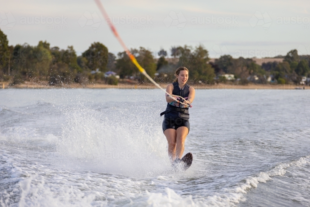female water skier on single ski at Lake Towerrinning - Australian Stock Image