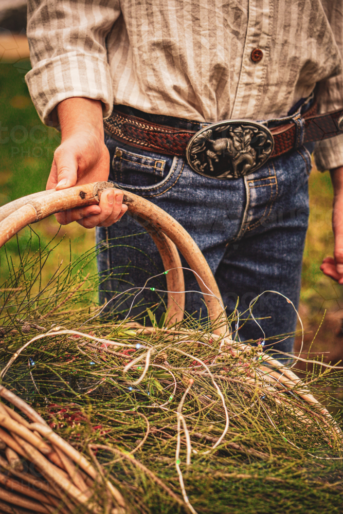 Festive basket held by young child in country - Australian Stock Image