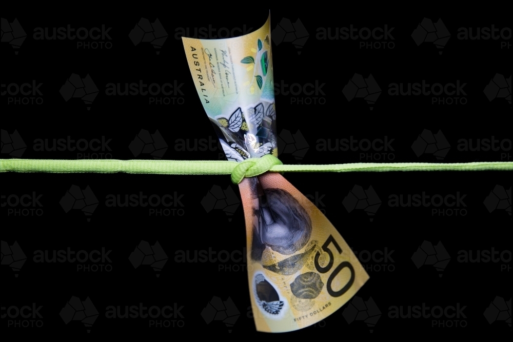 Fifty Dollars Tied in a Knot - Australian Stock Image