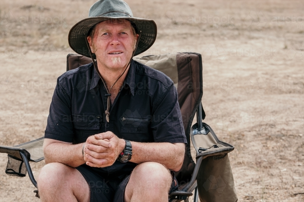 Fifty something year old man outdoors camping - Australian Stock Image