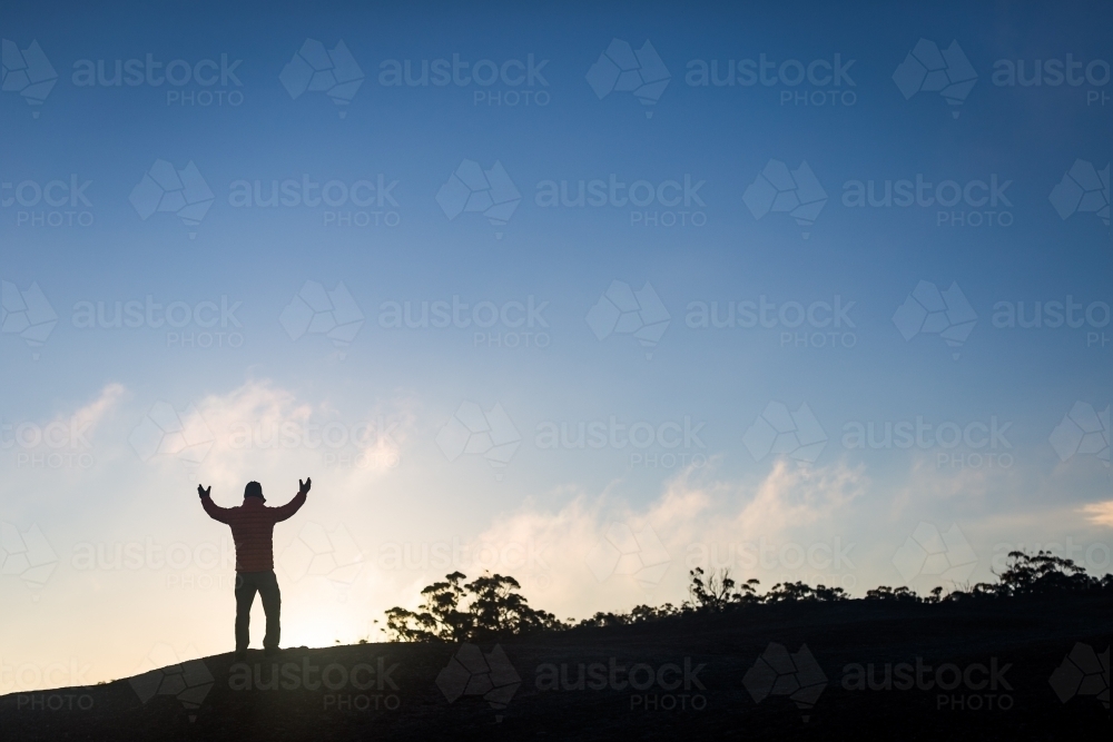 Figure against the sunrise - Australian Stock Image