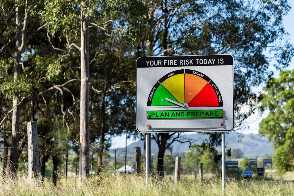 Fire danger rating sign on rural roadside in NSW Australia reading moderate plan and prepare - Australian Stock Image