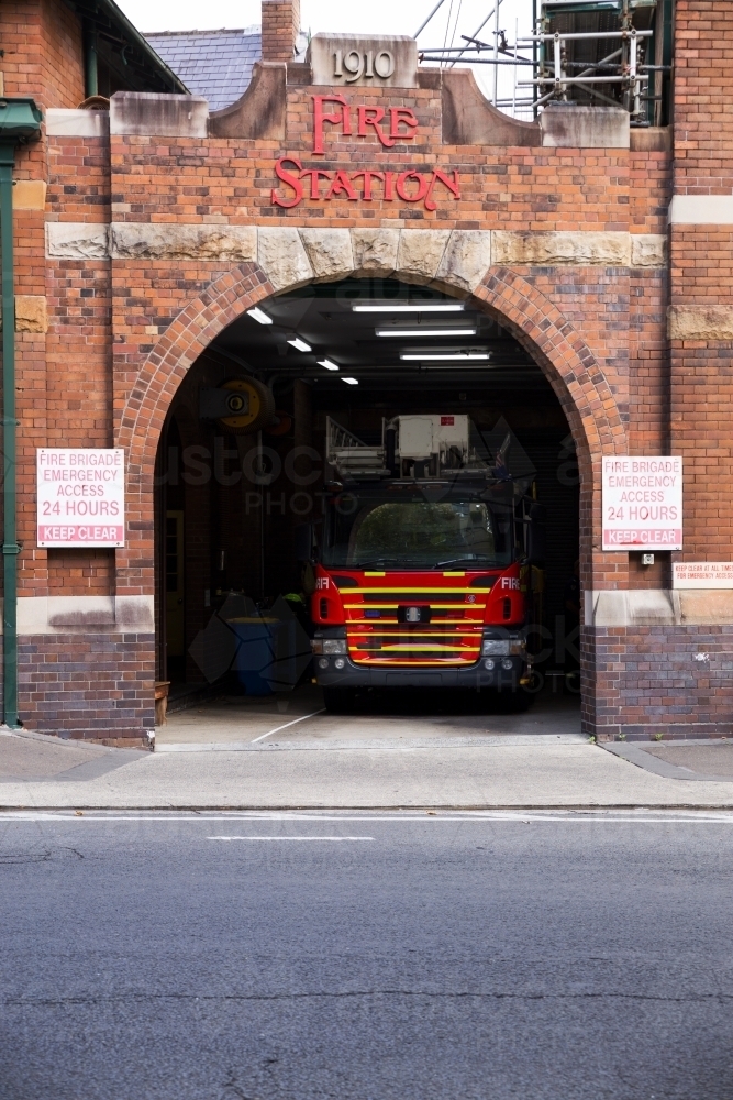 fire truck in fire station, vertical - Australian Stock Image