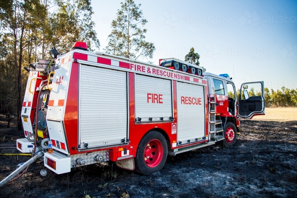 Fire truck with hose attached for fighting fire - Australian Stock Image