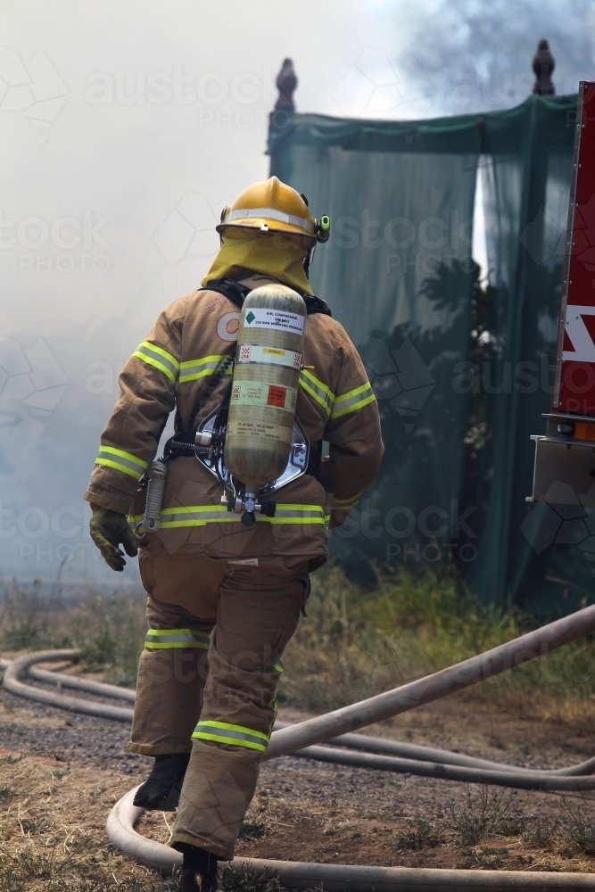 Firefighter with breathing apparatus - Australian Stock Image