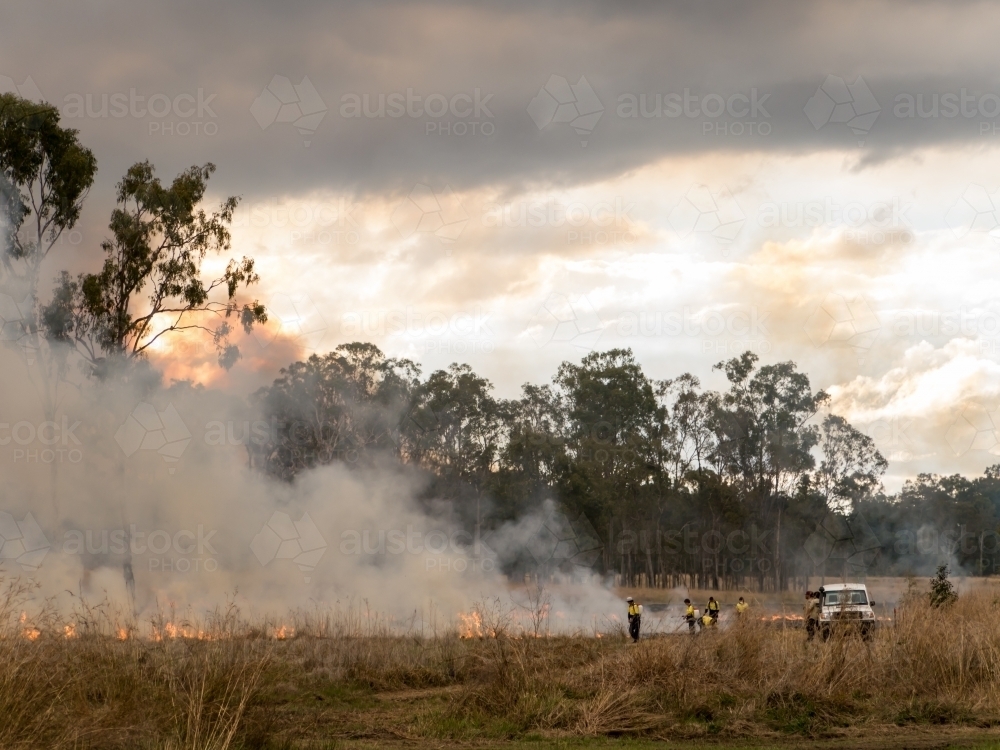 Firefighters attending a grass fire - Australian Stock Image