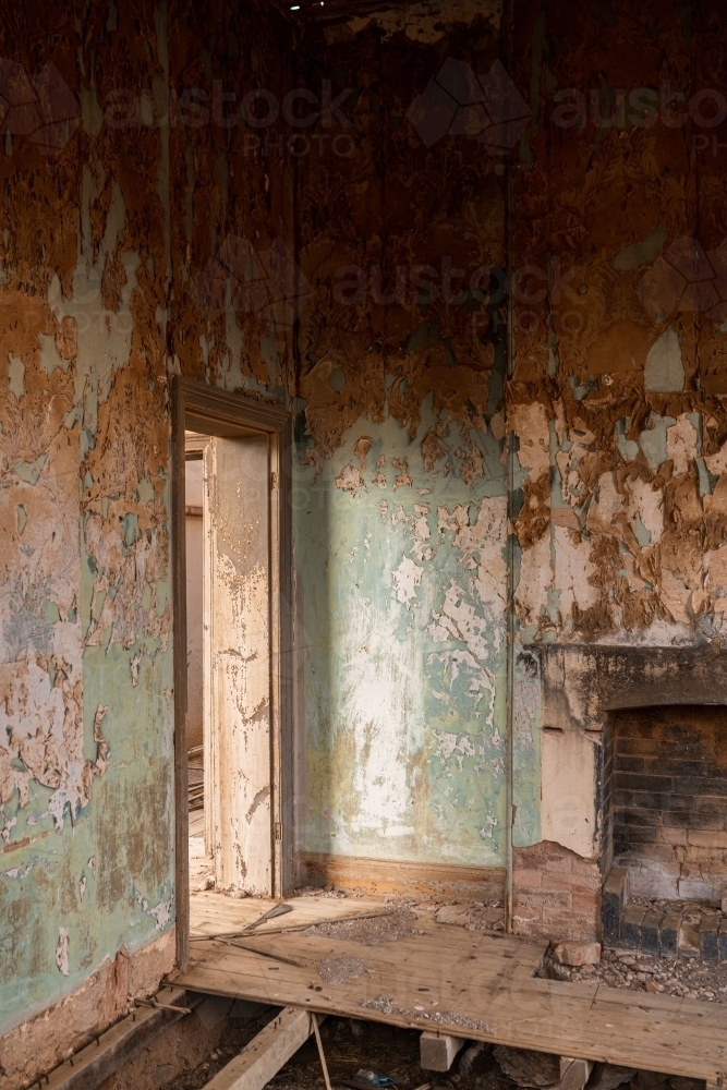 fireplace and doorway in old abandoned building - Australian Stock Image