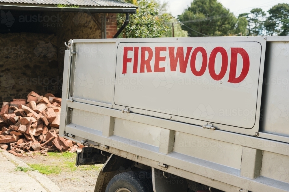 Firewood delivery in a small truck - Australian Stock Image