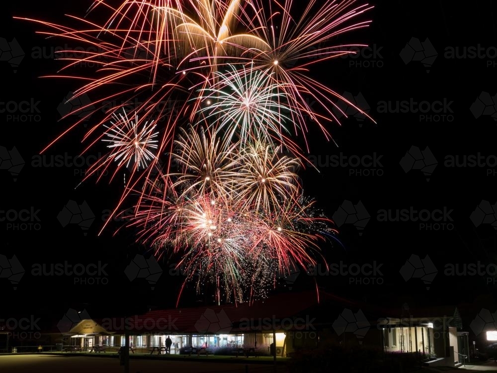 Fireworks exploding in the sky above Uralla Bowling Club - Australian Stock Image