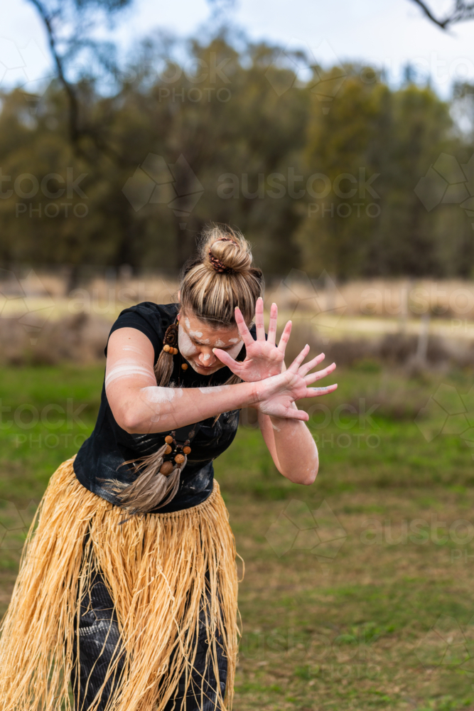 First nations Australian woman dancing to aboriginal music during welcome to country ceremony - Australian Stock Image