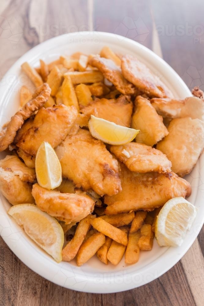 fish and chips in a large dish - Australian Stock Image