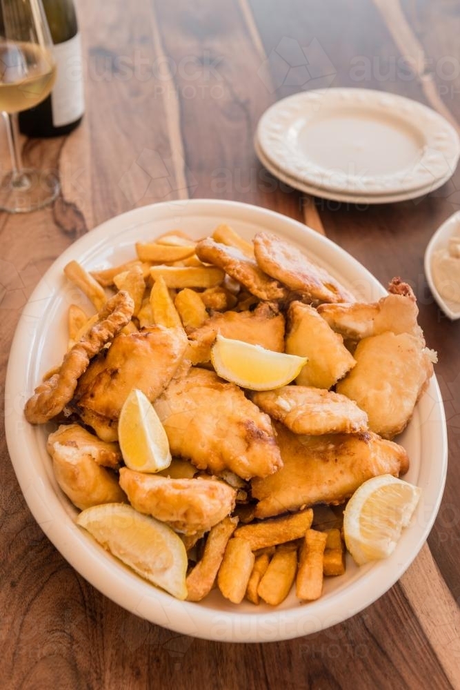 fish and chips in a large dish - Australian Stock Image