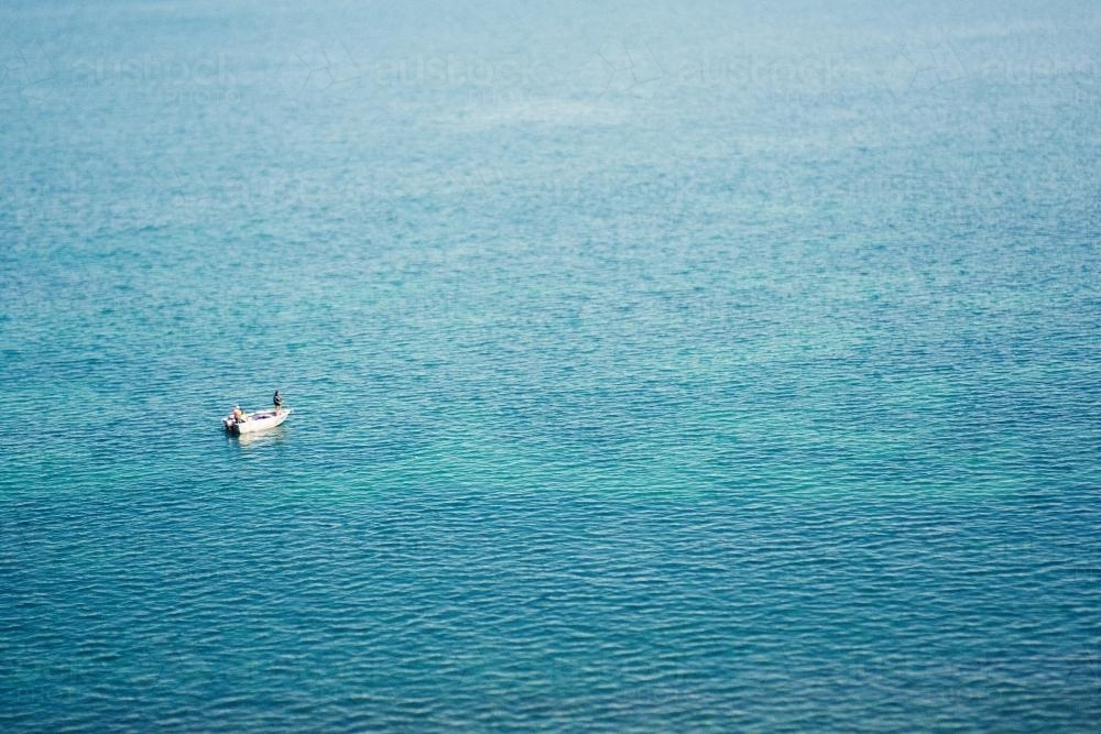 Fisherman on a fishing boat in the ocean - Australian Stock Image