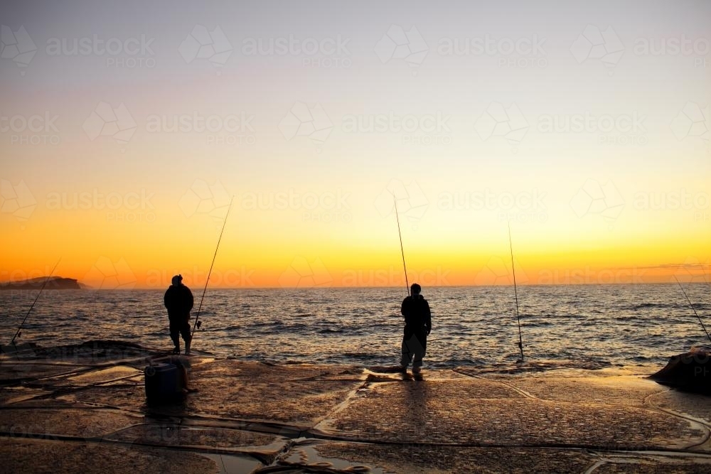 Fishermen on a rock platform - Australian Stock Image