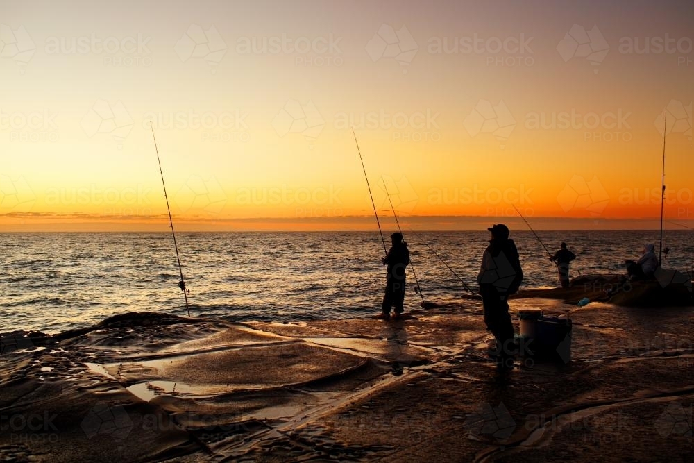 Fishermen on a rock platform - Australian Stock Image