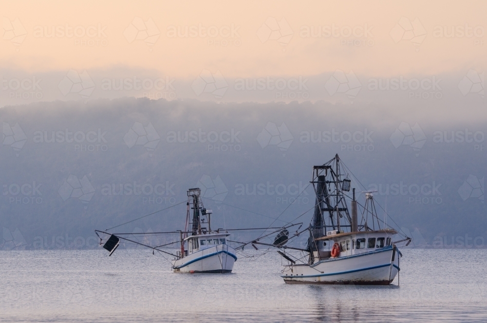Fishing boats anchored in the bay - Australian Stock Image