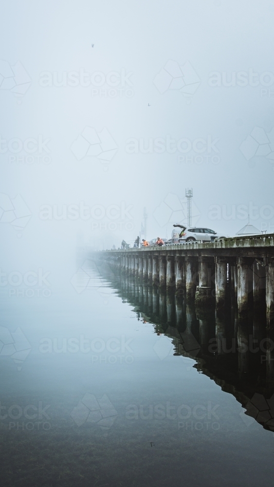 Fishing off a Pier - Australian Stock Image