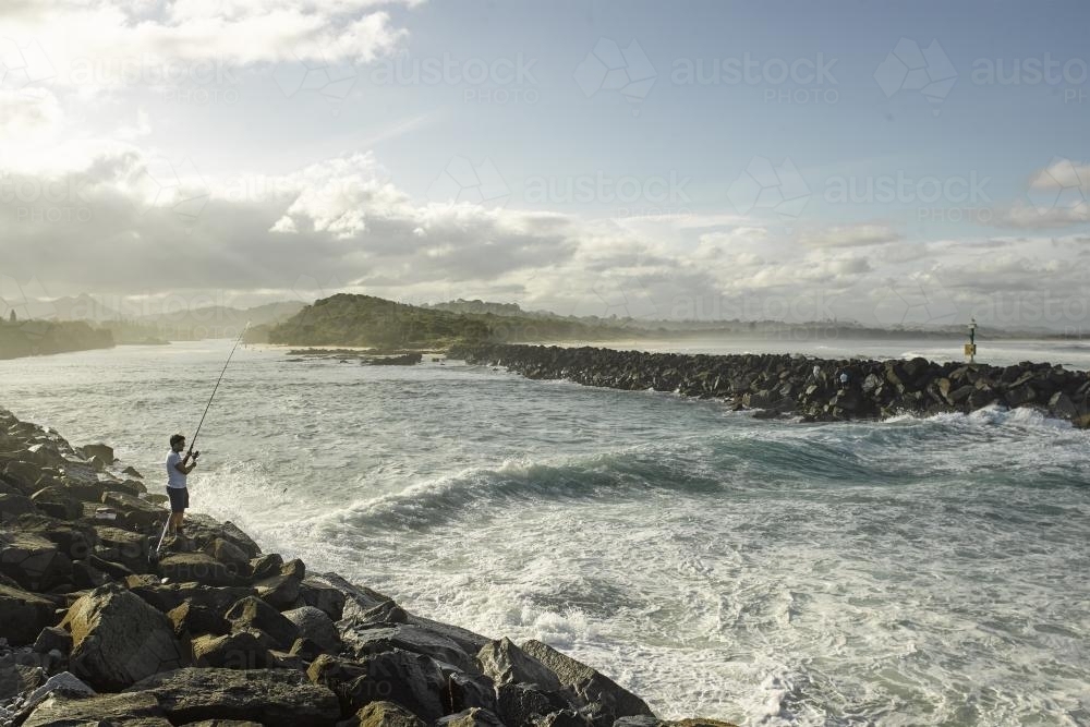 Fishing off the rocks - Australian Stock Image