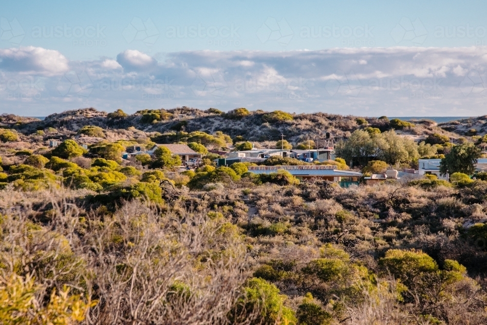 Fishing shacks community in the bush on the coast - Australian Stock Image