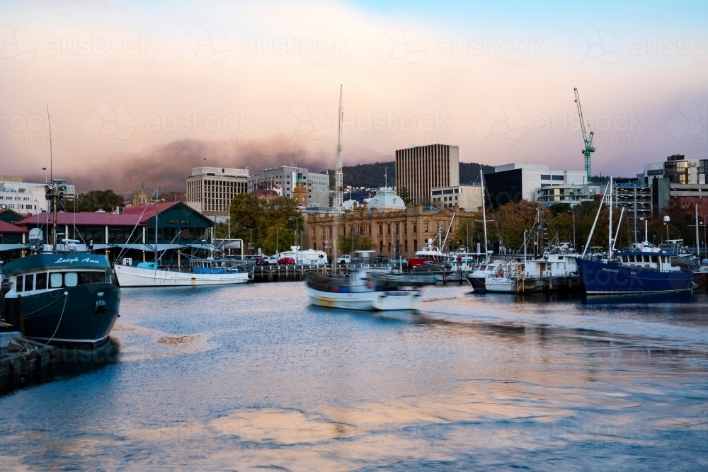 fishing trawler coming into berth - Australian Stock Image