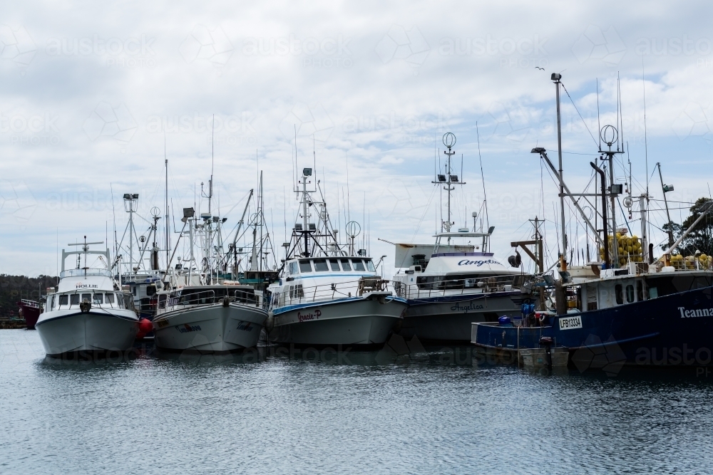 Image of fishing trawlers in ulladulla harbour Austockphoto