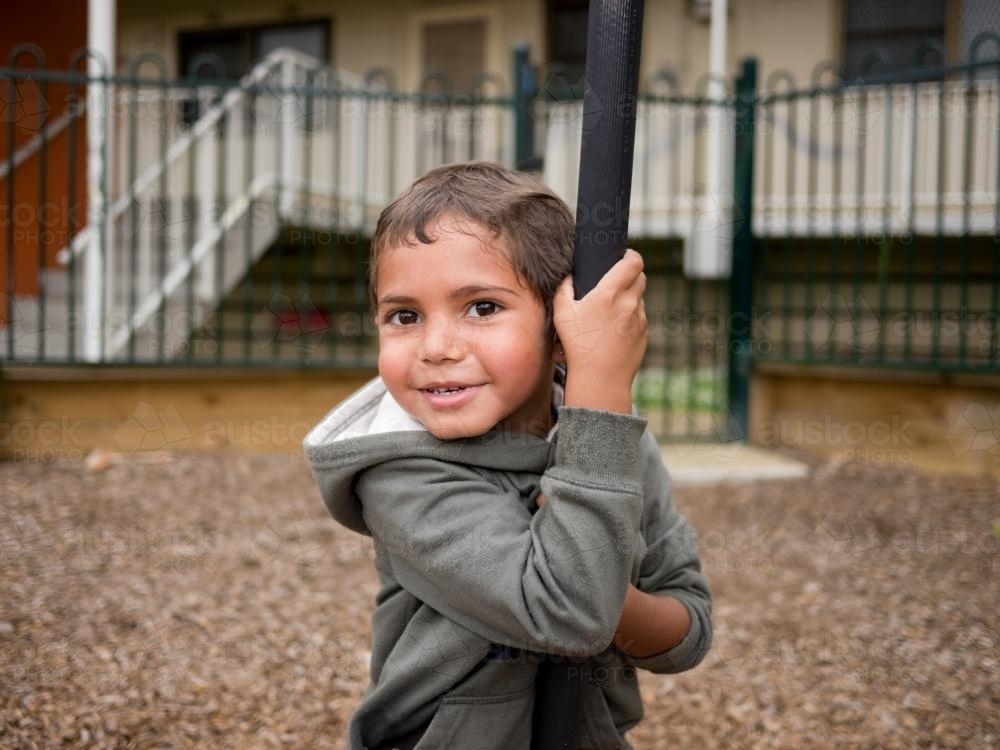 Five Year Old Aboriginal Boy in a Playground - Australian Stock Image