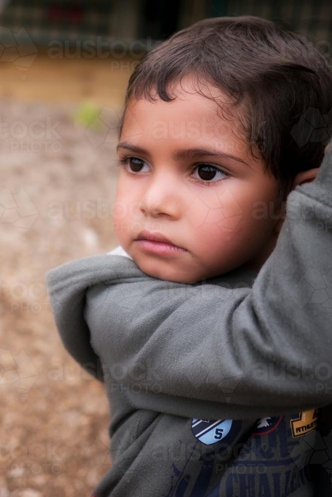 Five Year Old Aboriginal Boy with Serious Expression - Australian Stock Image