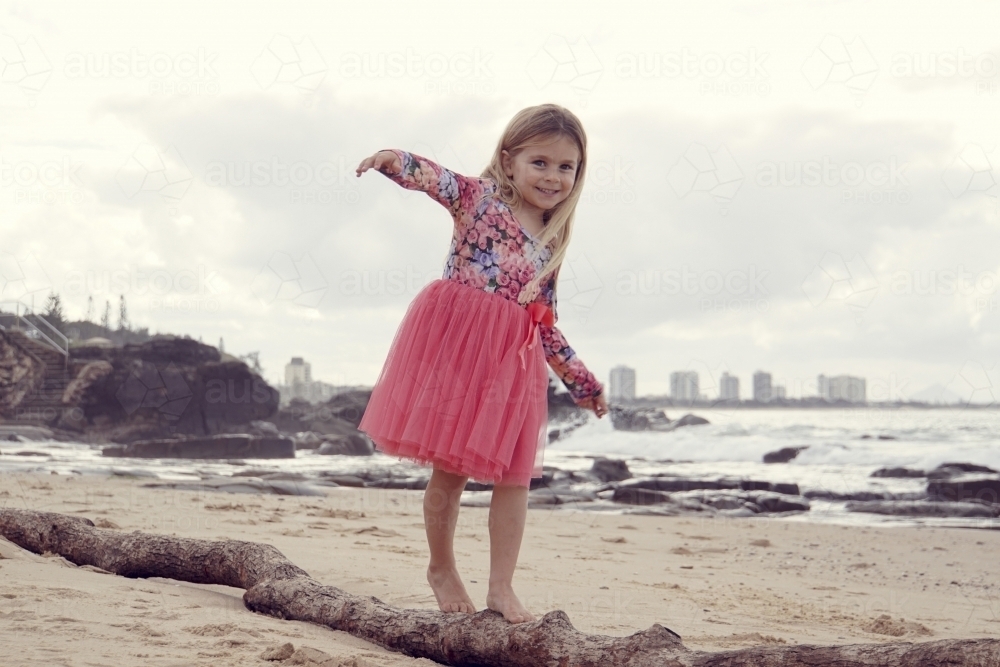 Five year old balancing old log - Australian Stock Image