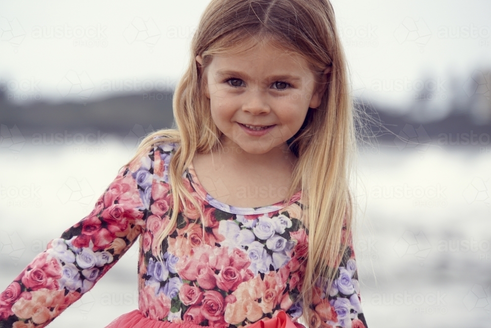 Five year old girl smiling at camera - Australian Stock Image