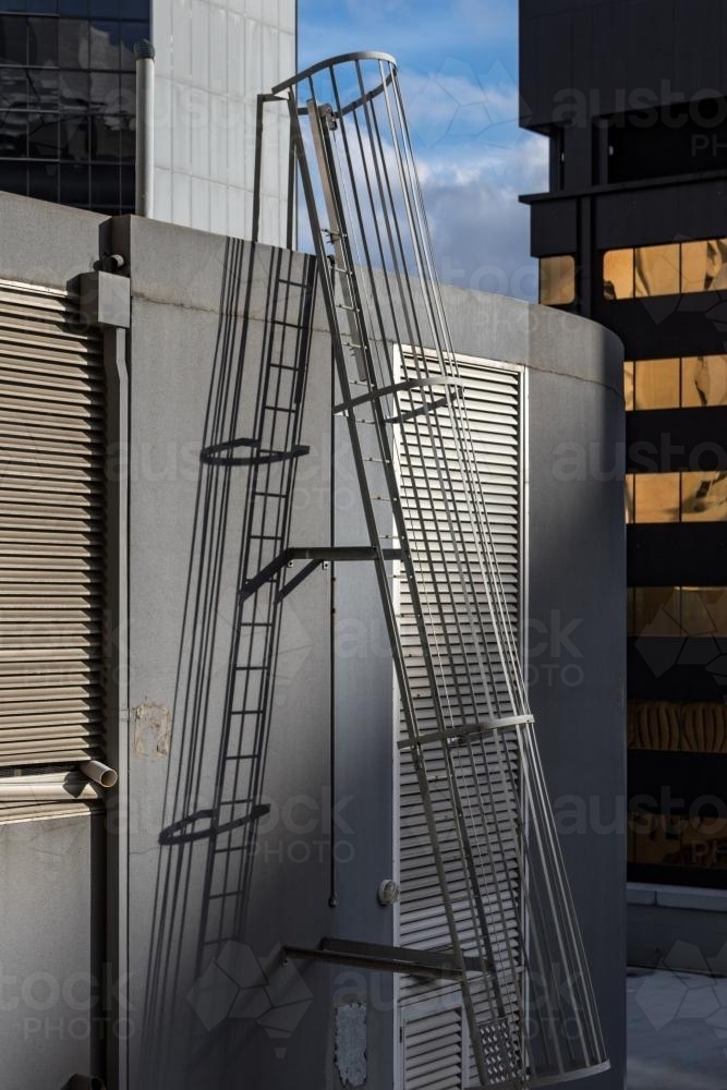 Fixed ladder on top of skyscraper - Australian Stock Image
