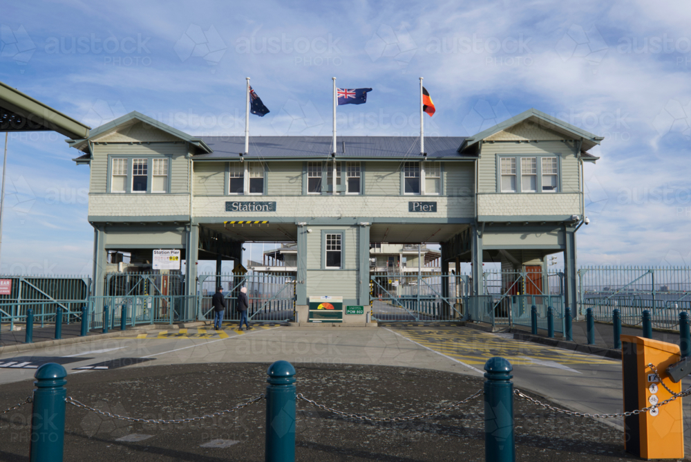 flags flying over Station Pier building, passenger shipping - Australian Stock Image
