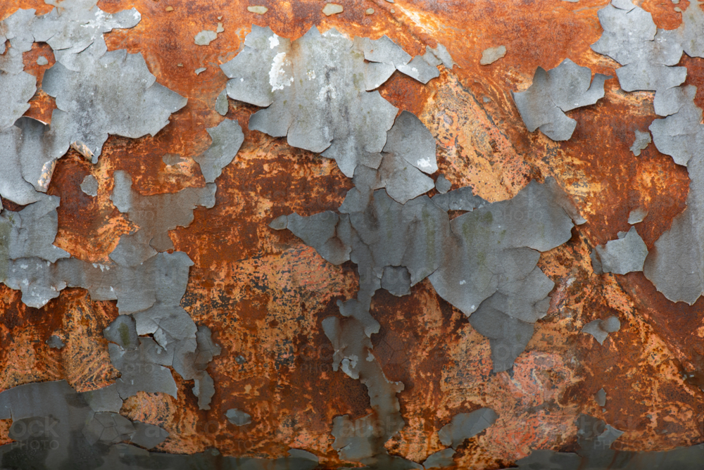 Flaking paint and rust on a water supply pipe. - Australian Stock Image