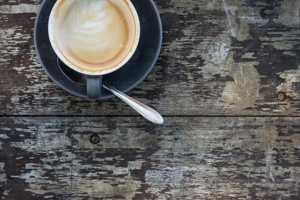 flat white coffee on a dark wooden background - Australian Stock Image