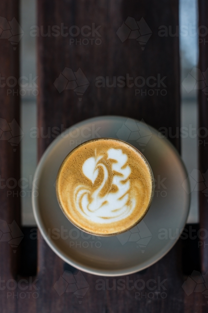 flat white coffee with swan shape latte art - Australian Stock Image
